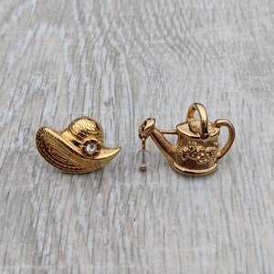 Set of Avon 1983 &quot;Favorite Pastimes&quot; Gold Tone Metal, Rhinestone, and Glass Bead Sun Hat and Watering Can Gardening Scatter Pins