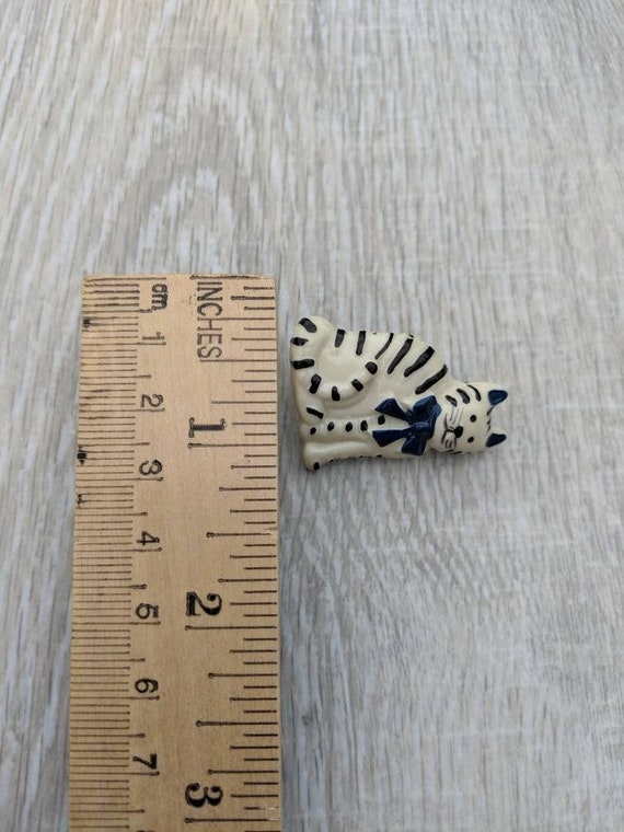 White Resin Cat with Black Stripes and a Navy Blu… - image 3