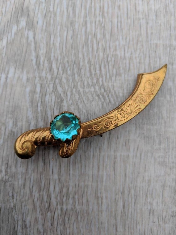 Aqua Rhinestone and Gold Tone Scimitar Brooch