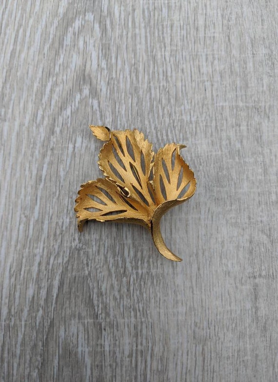 Brushed Gold Tone Metal Curled Cutout Leaf Brooch