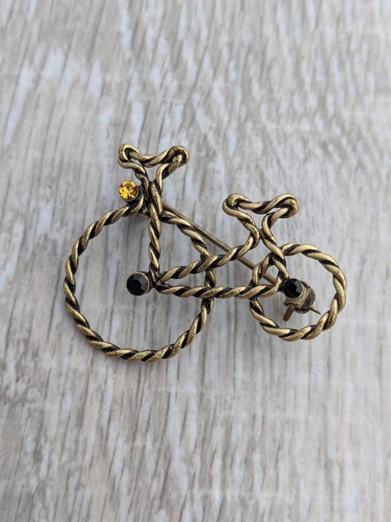 Jet Black Rhinestone and Bright Amber Colored Rhinestone Penny-Farthing or High Wheel Bicycle Brooch Bronze Tone Twisted Metal