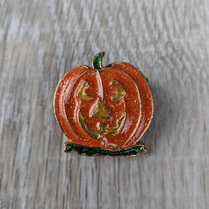 Orange, Yellow, and Green Sparkling Enamel and Gold Tone Metal Jack-o&#39;-Lantern Brooch