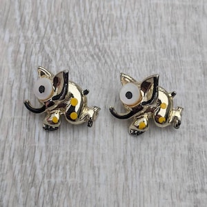 Pair of Black, White, and Yellow Resin, Enamel, and Gold Tone Metal Polka Dot Elephant Brooches
