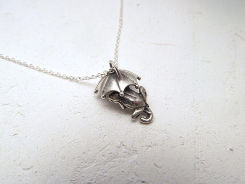 Frog pendant with umbrella open