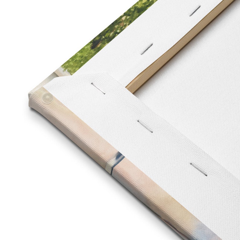 May include: Close-up of the back of a canvas print, showing the wooden frame and the stretched canvas. The canvas is wrapped around the frame and secured with staples.