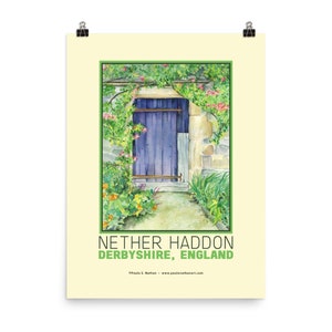 May include: A watercolor painting of a blue door with a stone frame, surrounded by lush green foliage and pink flowers. The text "Nether Haddon Derbyshire, England" is printed below the image.