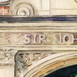 May include: A close-up of a stone archway with the inscription "SIR JOHN" above the entrance. The archway is decorated with intricate carvings and has a weathered, aged appearance.