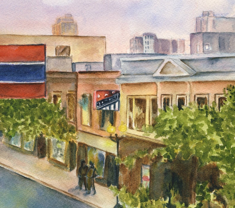 May include: A watercolor painting of a city street scene with buildings, trees, and people. The buildings are painted in shades of brown, yellow, and red. The trees are green and the people are wearing dark clothing. There is a sign on one of the buildings that says "The Roxy".