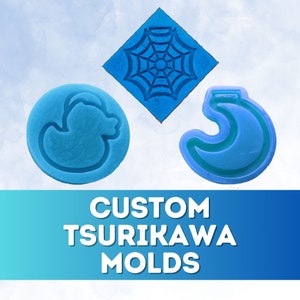 May include: Three blue silicone molds for making custom tsurikawa. The molds are shaped like a duck, a crescent moon, and a spider web.