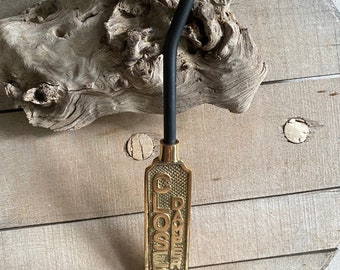 Dempertrekker van messing en ijzer