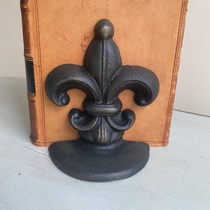 Suportes para livros flor de lis em ferro fundido (par)