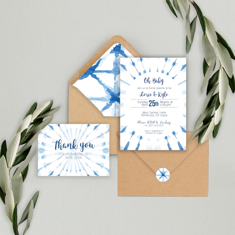 May include: A blue and white baby shower invitation with a watercolor design. The invitation says "Oh Baby" and includes the names "Lorie & Kyle" and the date "April 25th".