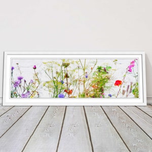 Multi coloured Wild flowers on a white background. Panoramic framed picture print. Choice of frame size, colour and border.