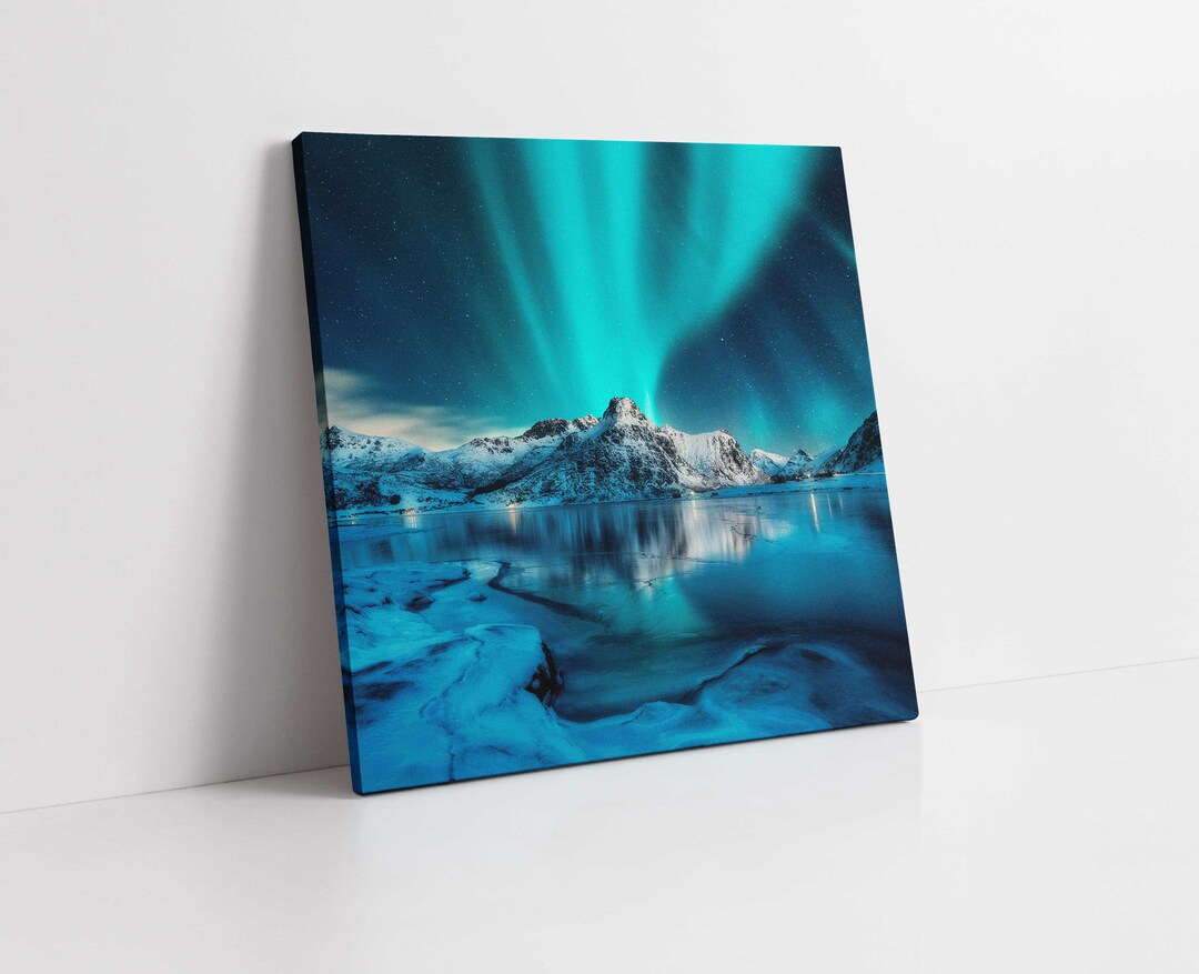 Northern Lights Over Snowy Mountains at Night. Reflection in the Frozen ...