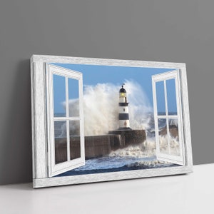 May include: A canvas print showing a lighthouse scene framed by an open window. The lighthouse, with black and white stripes, is set against crashing waves and a blue sky. The window frame is white.