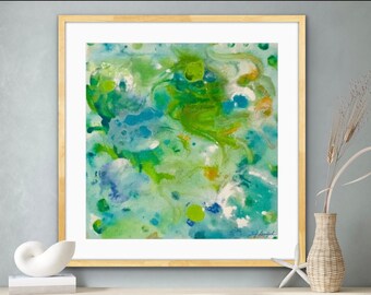 May include: Abstract art print in a gold frame. The artwork features a vibrant mix of green, blue, and yellow hues, creating a dynamic and fluid composition. The painting is signed in the bottom right corner.