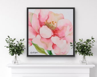 Könnte beinhalten: Ein Aquarellbild einer rosa Blume mit einem grünen Stiel und Blättern. Das Bild ist in einem schwarzen Rahmen gerahmt und hängt an einer weißen Wand.