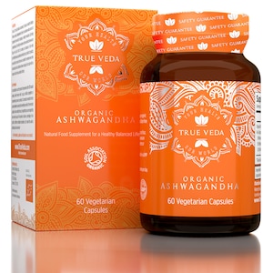 May include: A bottle of organic Ashwagandha capsules with a label that says "Your Health True Veda Our World". The bottle is orange and brown with a silver design. The label also says "Organic Ashwagandha 60 Vegetarian Capsules".