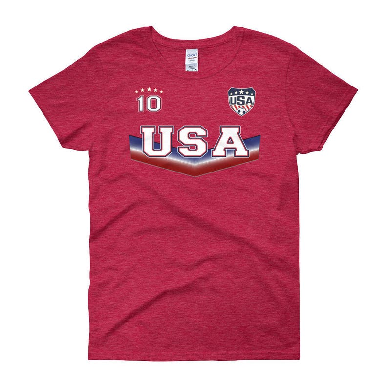 May include: Red t-shirt with a white and blue USA graphic and the number 10 on the front.