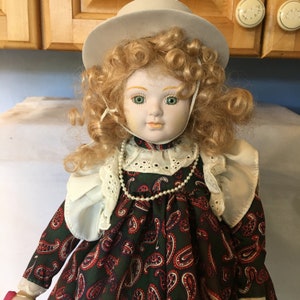 Vintage 17&quot; Porcelain Doll Wearing  Paisley Dress White Hat and Carrying a Shopping Bag