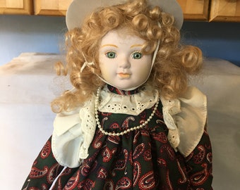 Vintage 17&quot; Porcelain Doll Wearing  Paisley Dress White Hat and Carrying a Shopping Bag