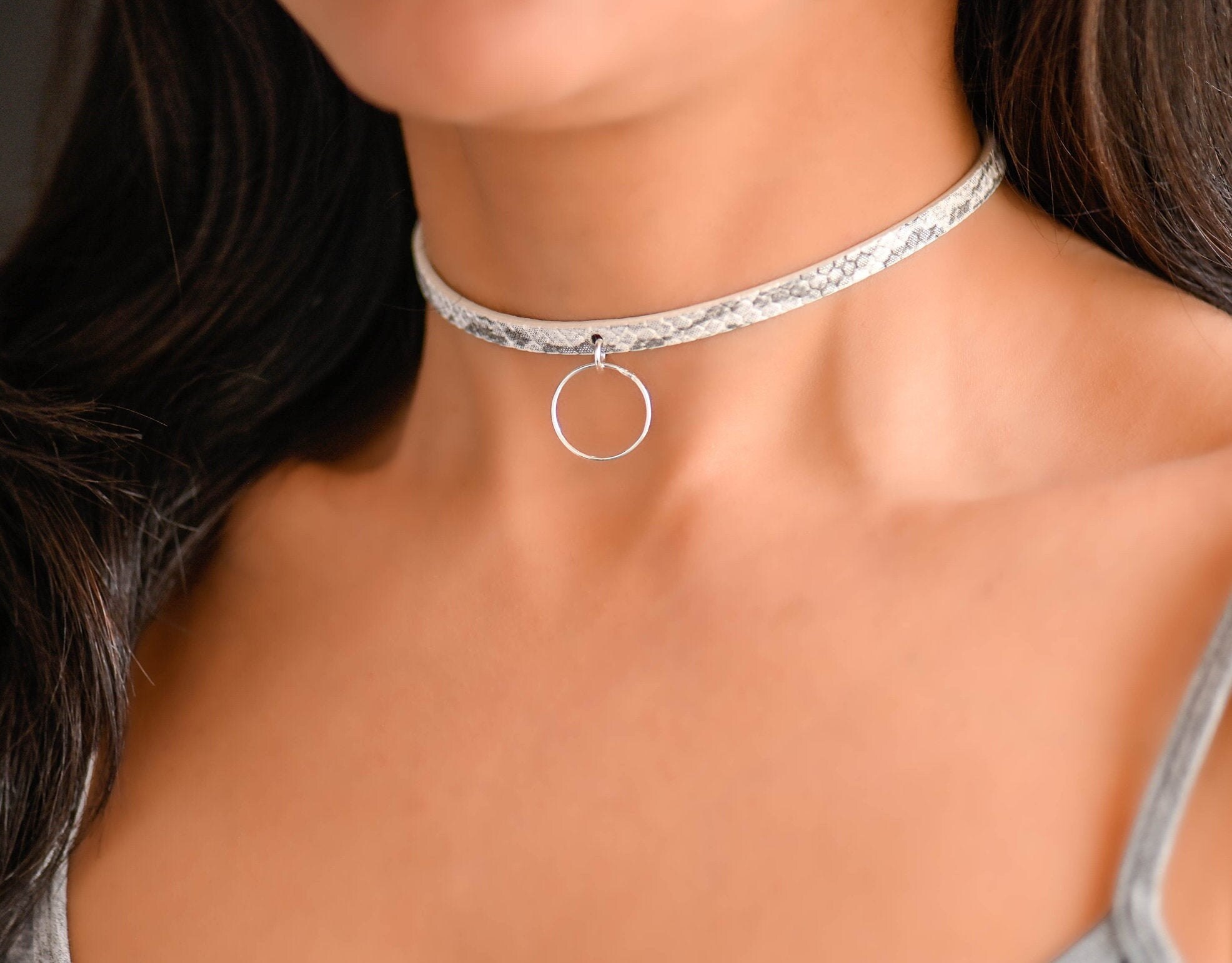 This BDSM day collar is discreet and has a symbolic o ring on pu leather th...