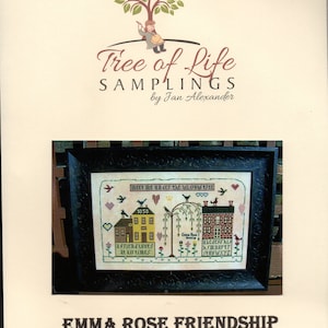 May include: A cross-stitch pattern featuring two houses with a willow tree in between. The text reads "Meet me under the willow tree" and "A friend loves at all times". The pattern is framed in a black frame with ornate detailing. The title "Emma Rose Friendship" is printed below the frame.