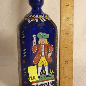 Old canteen flask of blue glass, with enamel colours.