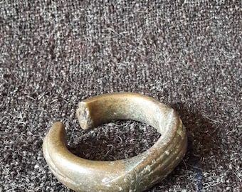 Cast bangle, massive brass, probably from Africa.