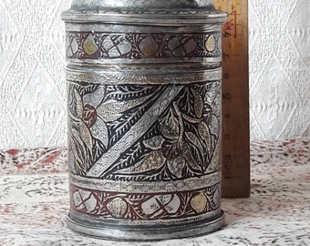 Vintage cylindrical metal box and lid, beautifully decorated with engraving and lacquer, from India