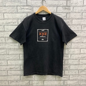 May include: Black t-shirt with a white square graphic featuring the text "xyz clothing co. USA".