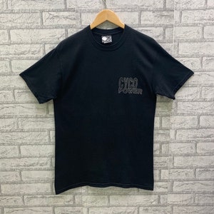 May include: Black t-shirt with a white outline of the text "CYCO POWER" on the front.