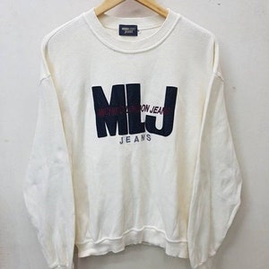 May include: White long-sleeve sweatshirt with a black and red logo that says "MLJ MICHIKO LONDON JEANS".
