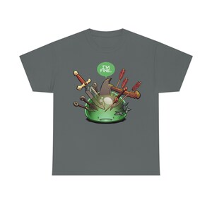 May include: A dark gray t-shirt with a green slime monster graphic. The slime monster is covered in weapons, including a sword, an axe, and arrows. A speech bubble above the slime monster says "I'm fine."