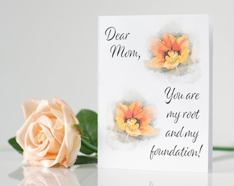May include: A white card with a watercolor illustration of orange tulips and the text "Dear Mom, You are my root and my foundation!"