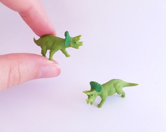 tiny plastic dinosaurs