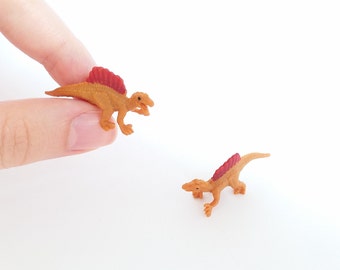 tiny rubber dinosaurs