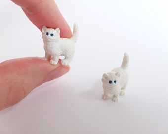 small plastic toy cats