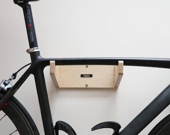 Soporte de pared para bicicleta/portabicicletas, soporte para estante, almacenamiento de muebles, madera contrachapada de abedul, acabado/MAURAD de Huxlo