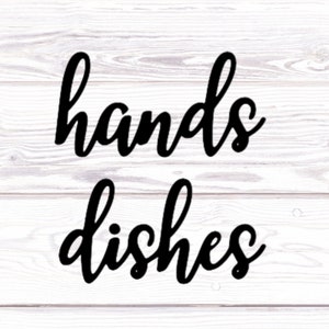 May include: Black and white cursive text on a white wood background that reads "hands dishes".