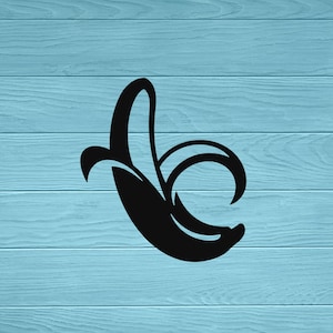 May include: A black silhouette of a banana with a curved shape, set against a light blue wooden background.