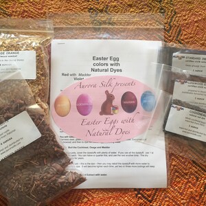 May include: A set of natural dyes for Easter eggs, including osage orange, madder root, logwood extract, cochineal, and indigo. Each dye comes in a small bag with a label indicating the name, origin, and weight (4 ounces). The instructions for dyeing eggs with natural dyes are included.