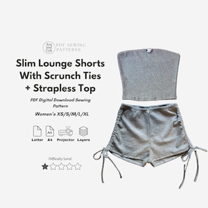 May include: A gray strapless top and matching lounge shorts with scrunch ties. The text on the image reads "Slim Lounge Shorts With Scrunch Ties + Strapless Top" and "PDF Digital Download Sewing Pattern". The difficulty level is two out of five stars.