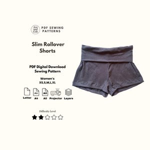 以下が含まれることがあります： グレーのリブ編みスリムロールオーバーショーツ。画像には「Ave and Coh PDF Sewing Patterns」と「Slim Rollover Shorts」の文字が含まれています。パターンは、女性用サイズXS、S、M、L、XLのPDFデジタルダウンロードです。