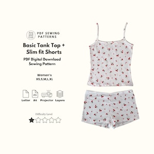 May include: White tank top and shorts set with a red cherry pattern. The set includes a camisole top with thin straps and matching shorts. The image also includes text that says "Basic Tank Top + Slim fit Shorts" and "PDF Digital Download Sewing Pattern".