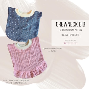 May include: A sewing pattern for a crewneck bib for babies and toddlers. The pattern includes instructions for making a bib with an optional food catcher or ruffle. The bib is shown in two colors: blue with white polka dots and pink.