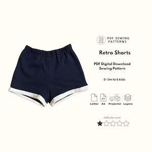May include: Navy blue retro shorts with white trim, a PDF digital download sewing pattern. The pattern is for sizes 0-3 months to 6 kids. The image includes the text "Retro Shorts" and "PDF Sewing Patterns".