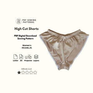 Puede incluir: Unos shorts de corte alto de satén color beige claro con ribete de encaje blanco. La imagen incluye texto que dice: "Ave and Coh PDF Sewing Patterns High Cut Shorts PDF Digital Download Sewing Pattern Women's XS, S, M, L, XL".