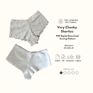 May include: Two pairs of white shorties are displayed. One is made of lace, the other of cotton. The image includes text that reads "Very Cheeky Shorties" and "PDF Digital Download Sewing Pattern". Sizes XS, S, M, L, and XL are listed.