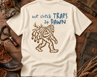 We Check Traps at Dawn Bigfoot Trapping T-Shirt